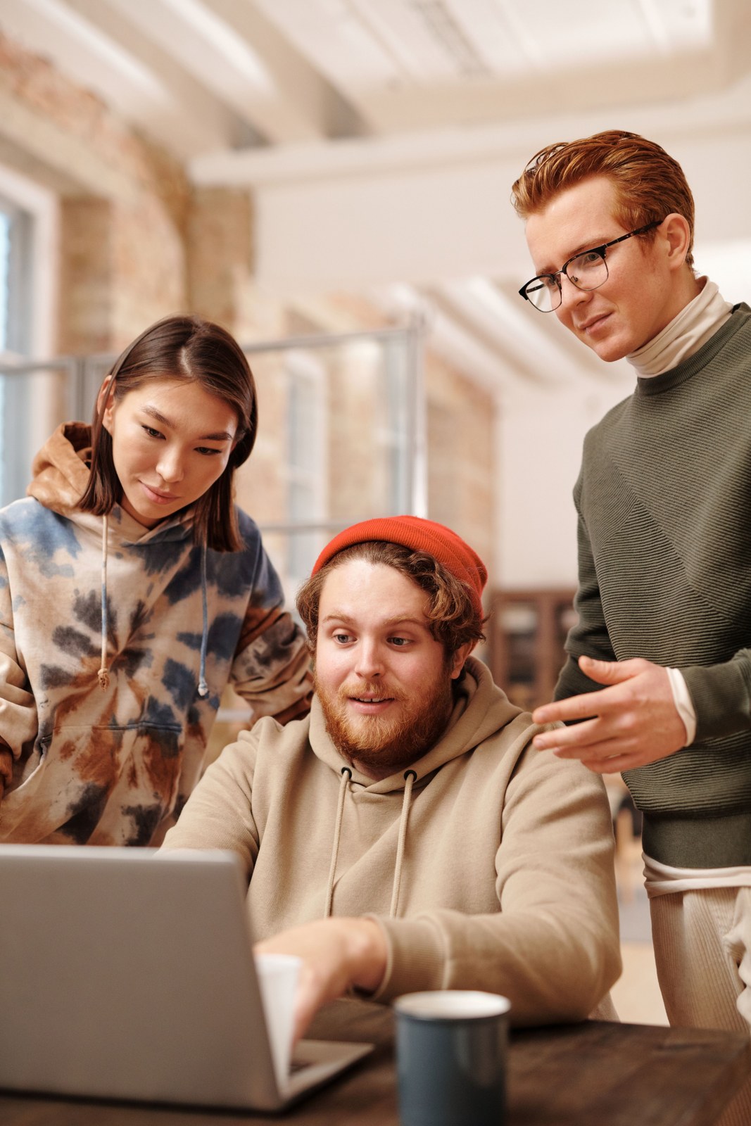 Business professionals collaborating over a laptop
